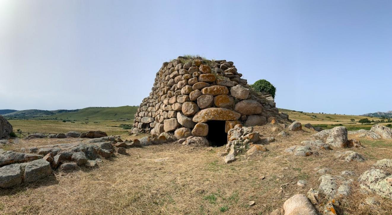 Children and adults engaging in Neolithic-themed educational activities, including pottery making and tool crafting at the Taş Tepeler site.