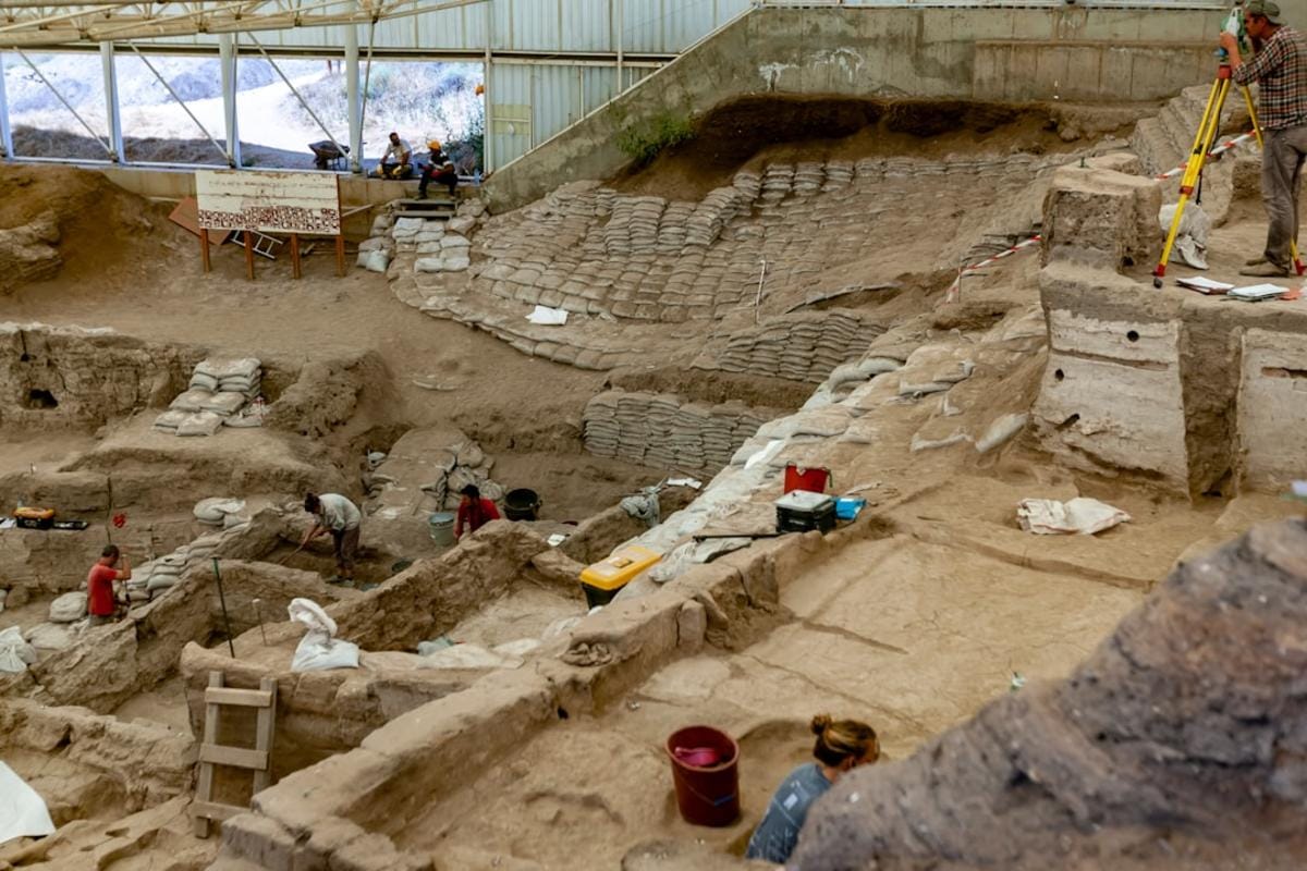 Close-up images of polished stone tools and Neolithic pottery from excavations