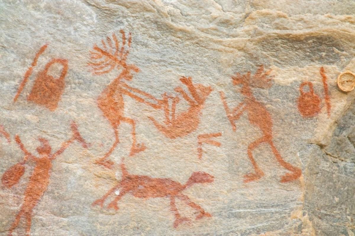 An artist’s reconstruction of a Neolithic village with early inhabitants engaging in daily activities