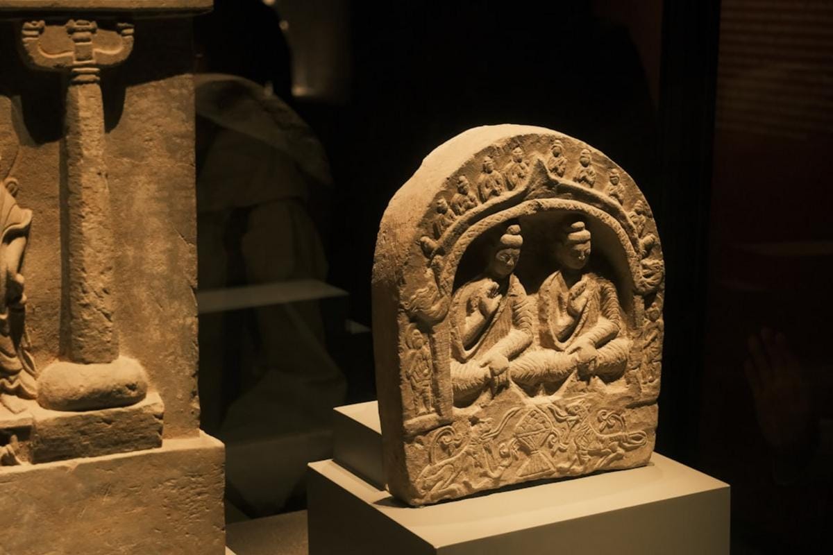 Interactive digital display showing Neolithic era artifacts and village life