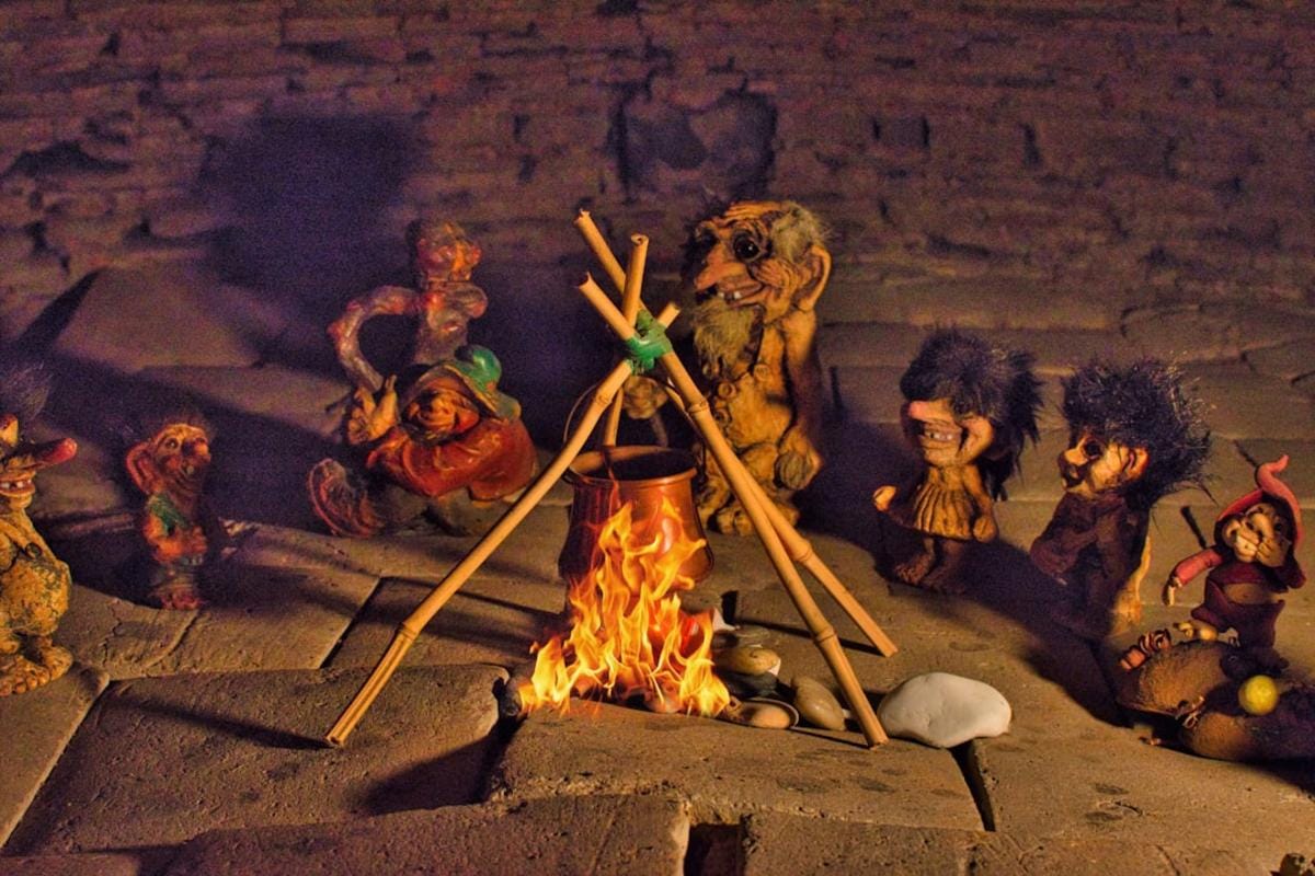 Children engaging with Neolithic-themed educational toys and storybooks